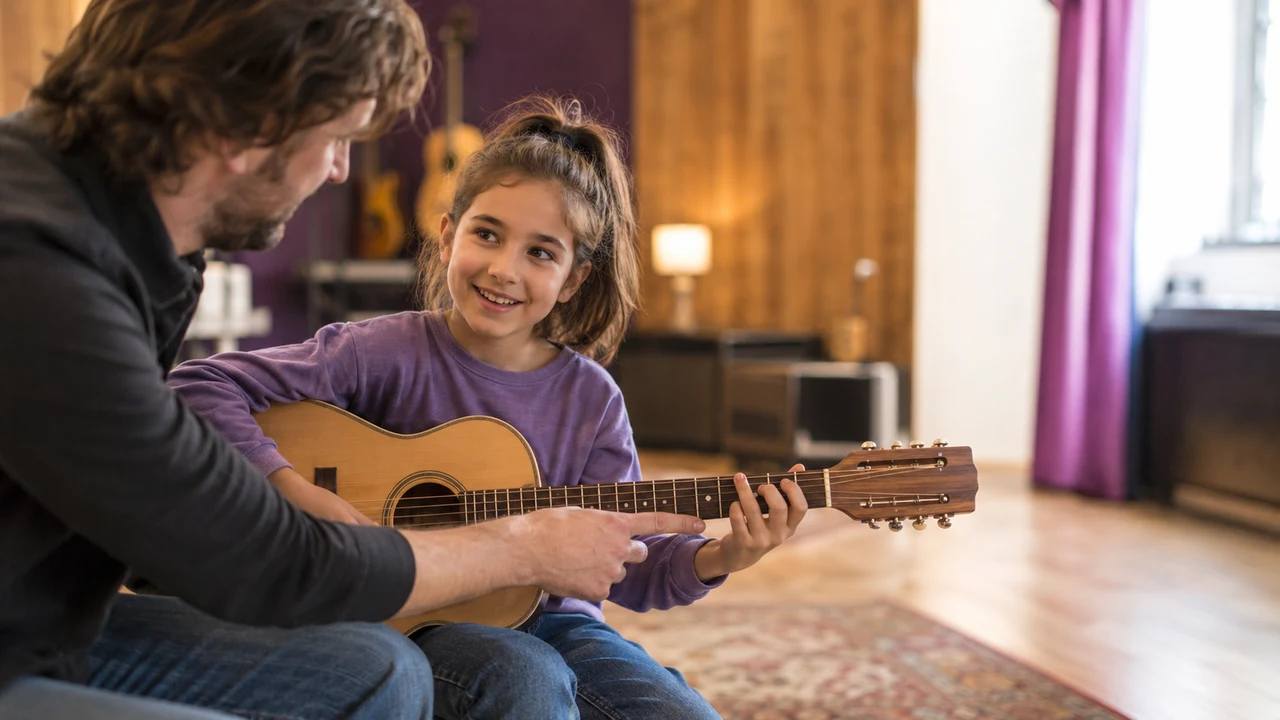 A child during a one-on-one guitar lesson